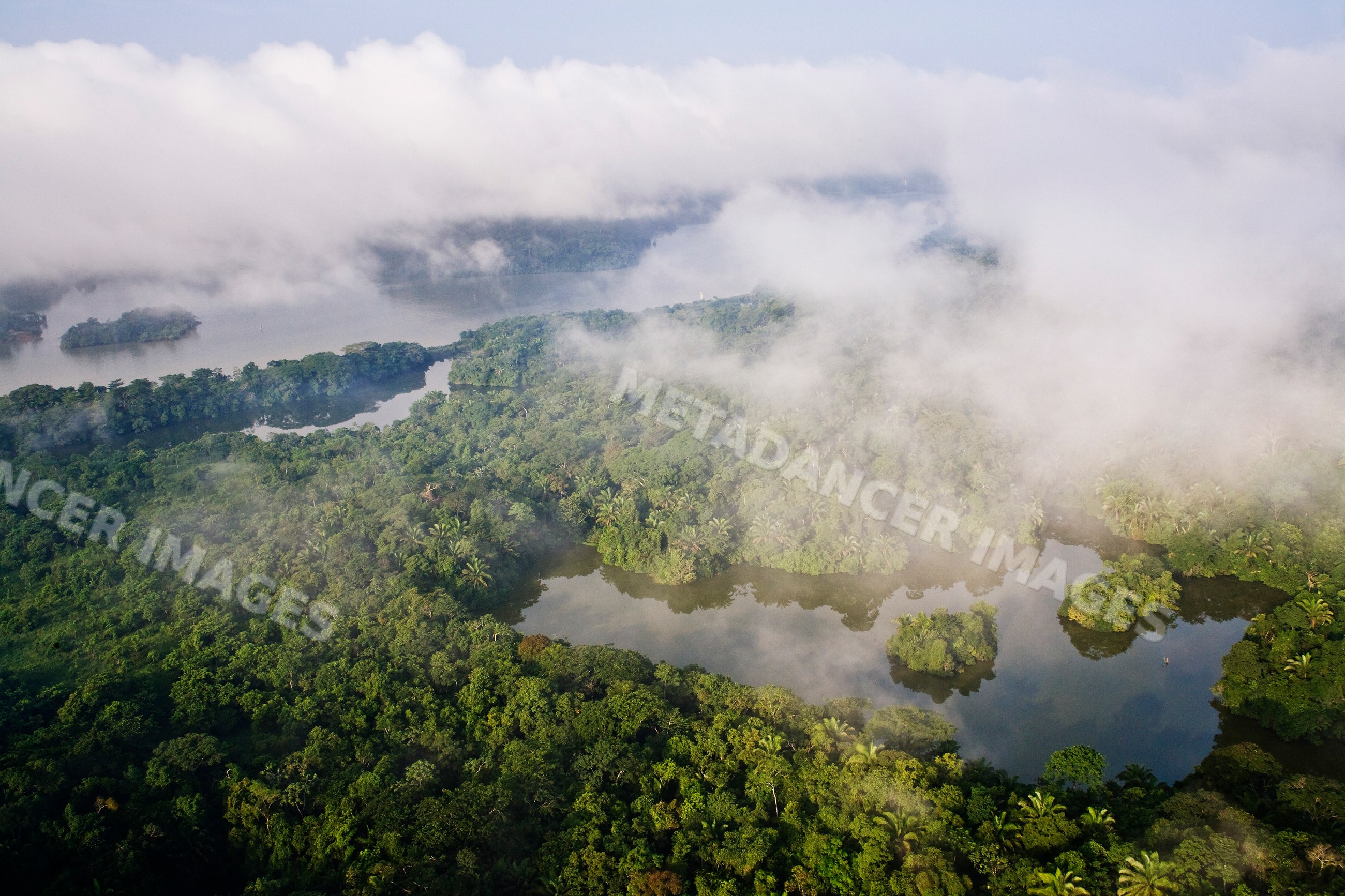 Aerial view of foggy rainforest and river islands along panama canal