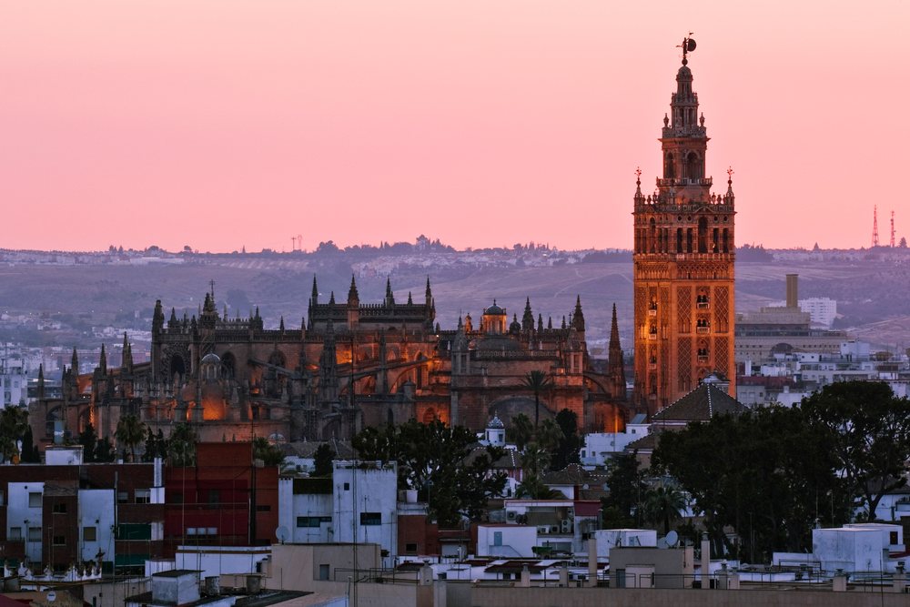 Seville cathedral and la giralda tower at sunset Spain
