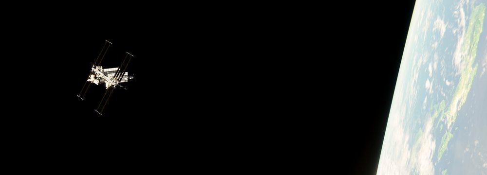 An orbital station orbiting earth with solar panels deployed