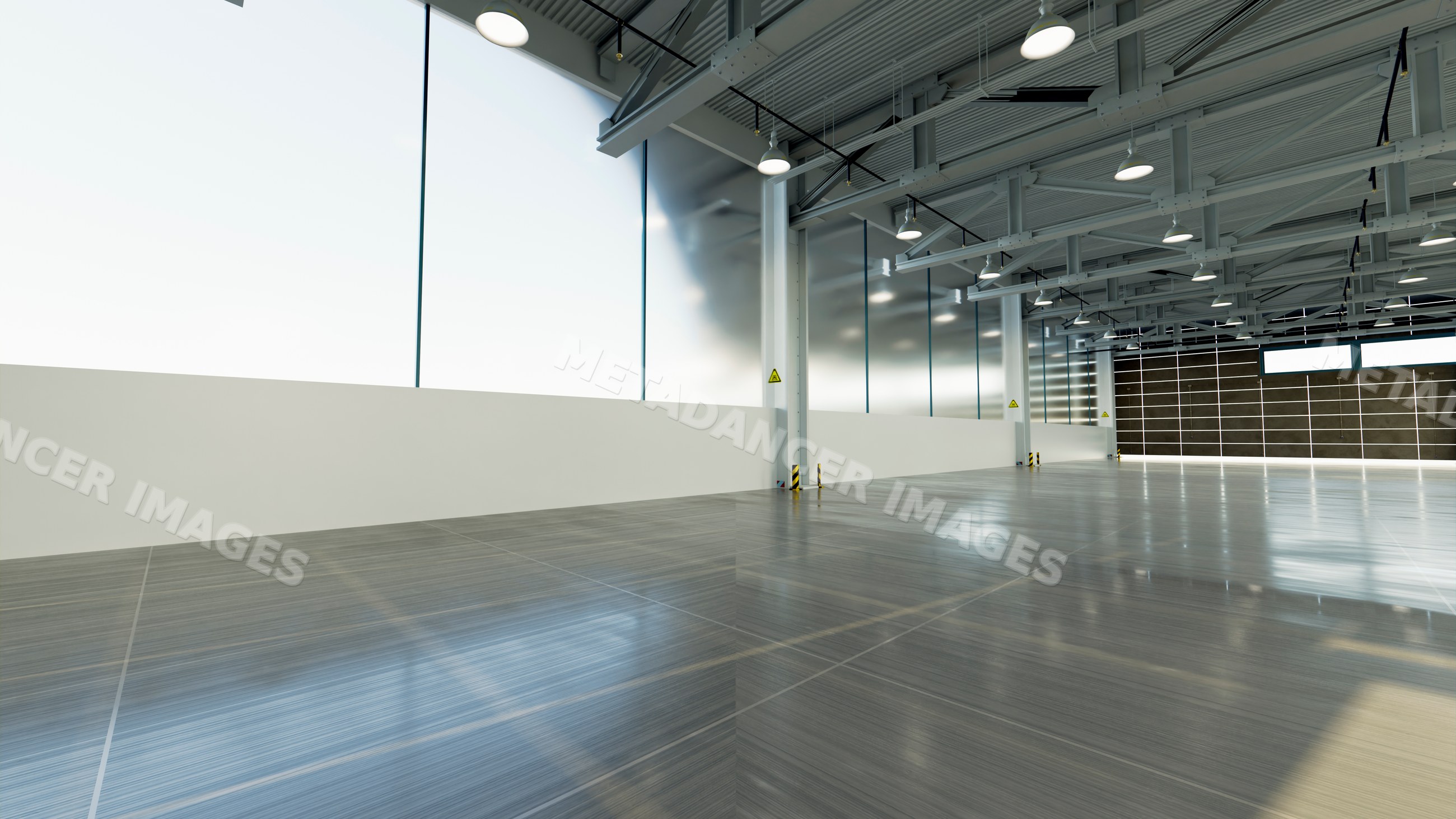 Empty industrial warehouse interior with large windows and high