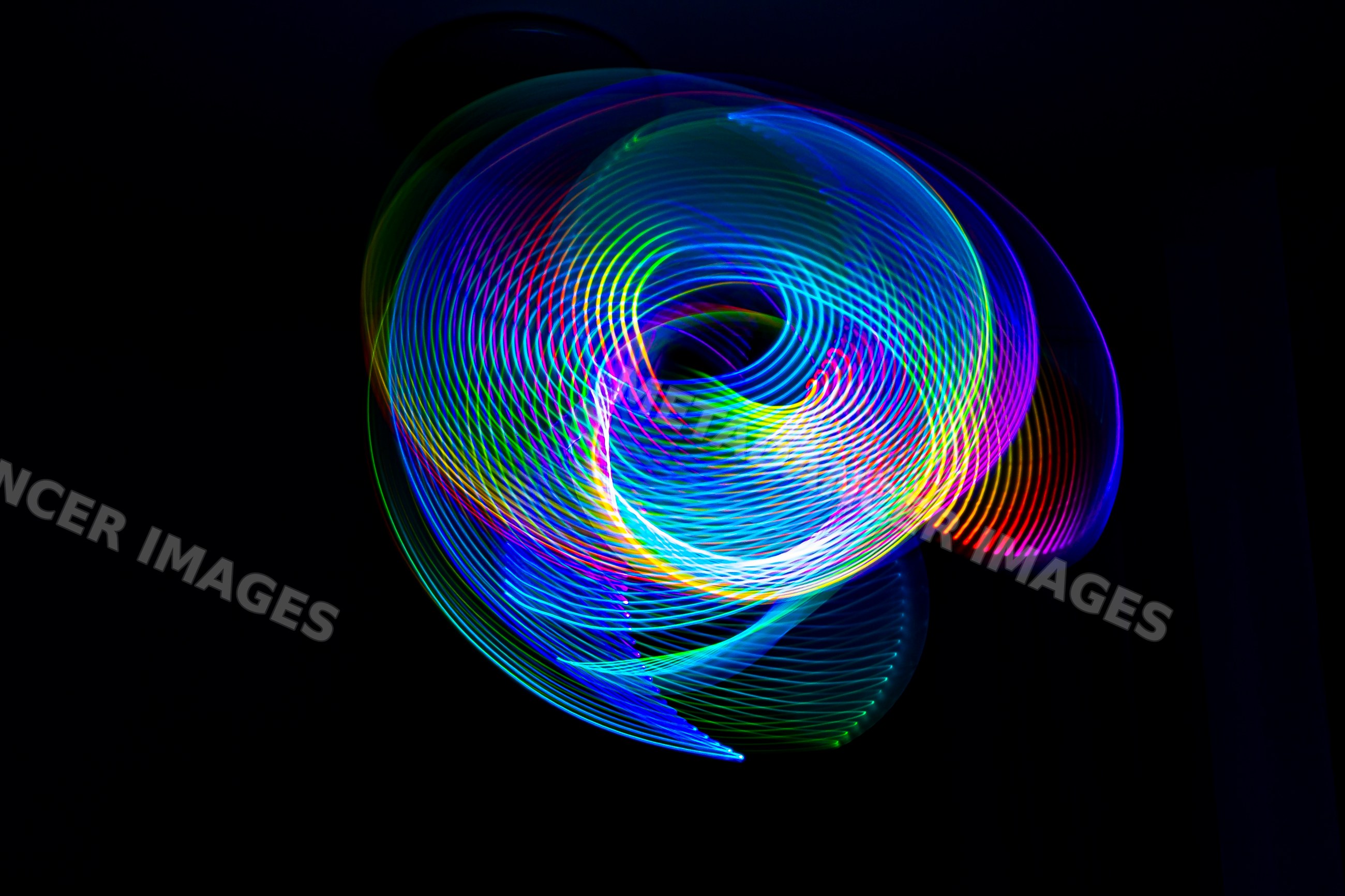 Colorful abstract LED light painting with spiral and swirl patterns