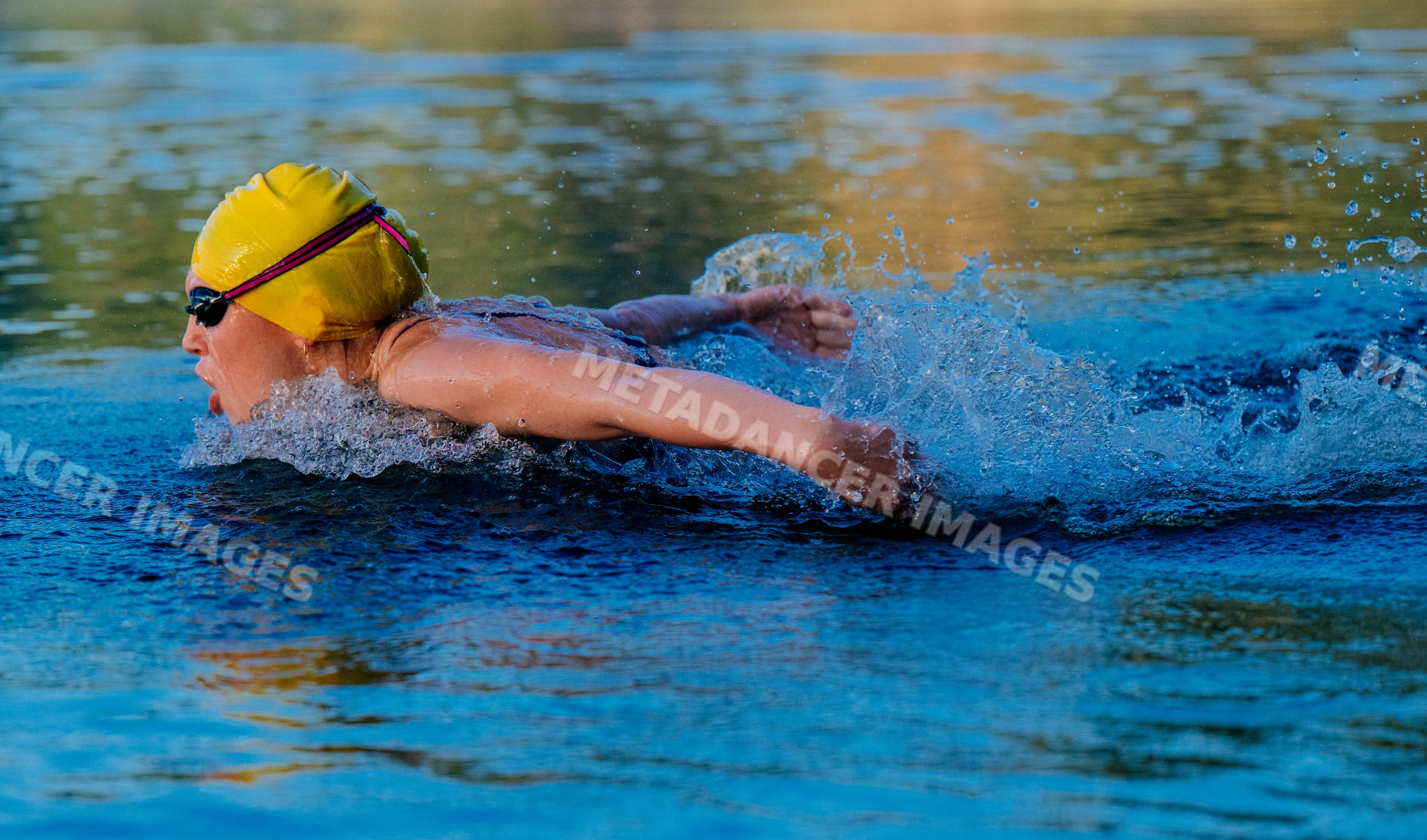 White swimmer performing butterfly stroke