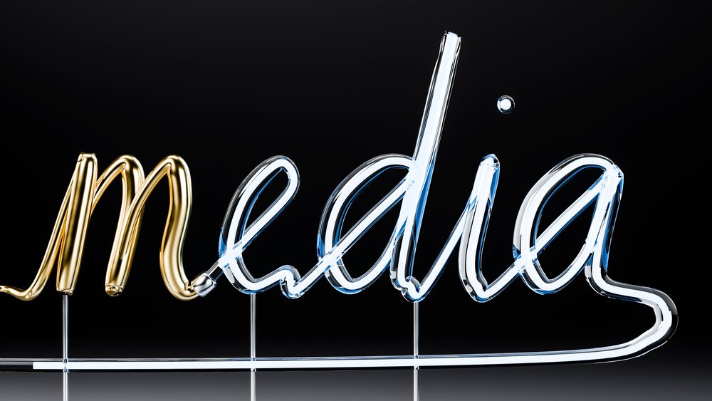 Media word in glowing glass neon light tubes
