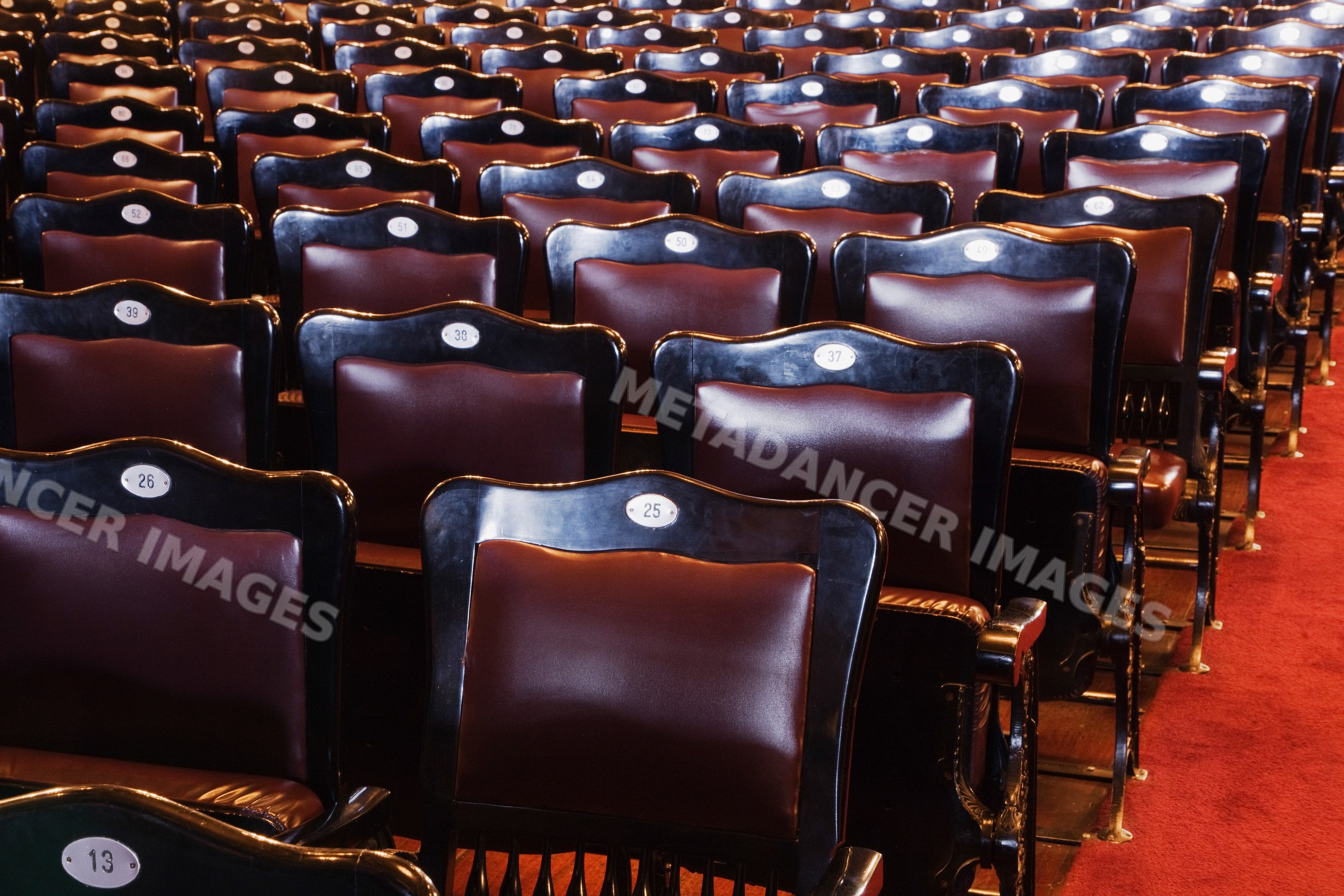 Empty numbered theater seats with leather backs costa rica