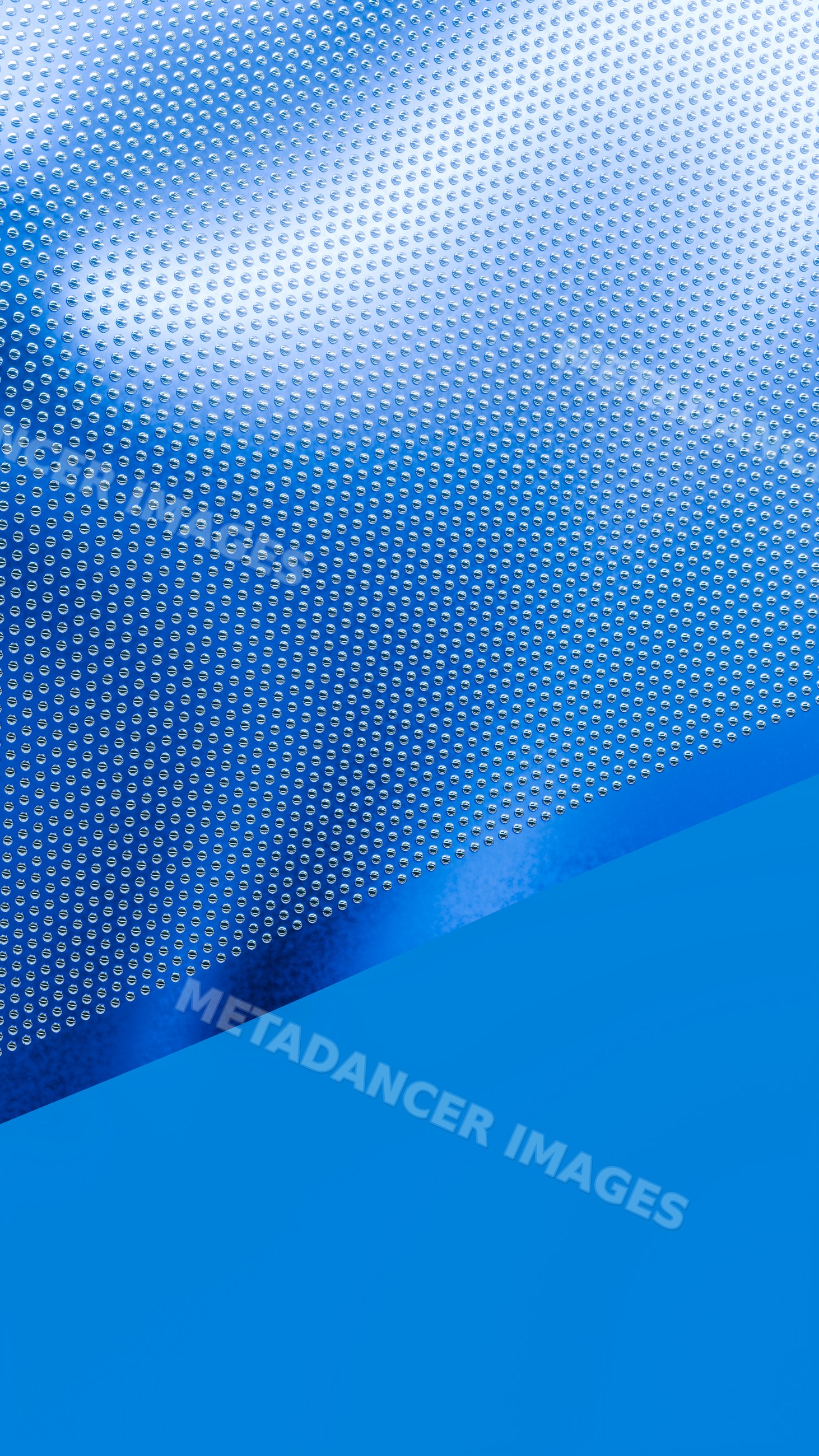 Shiny blue metal surface with dotted pattern