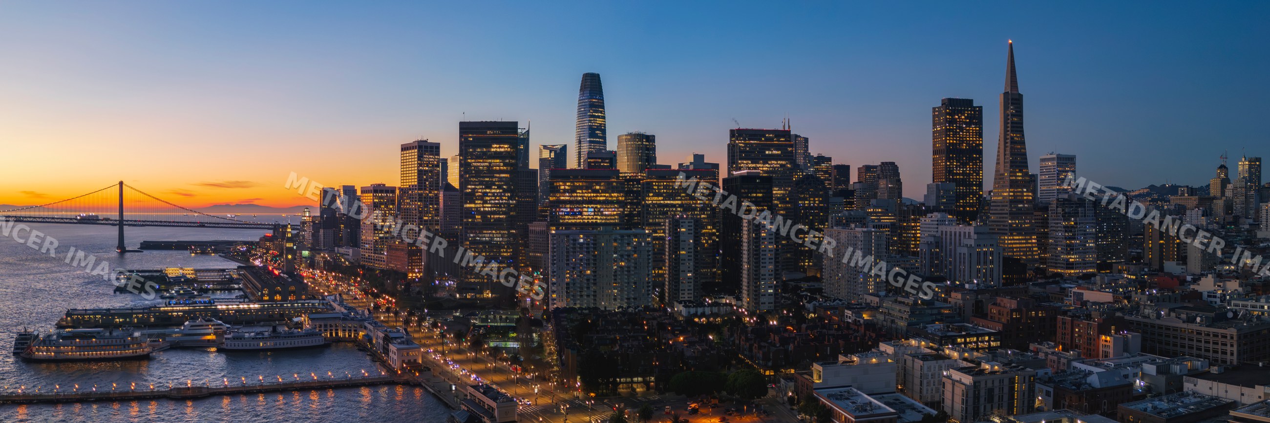 San Francisco cityscape at dusk with waterfront and pier 7