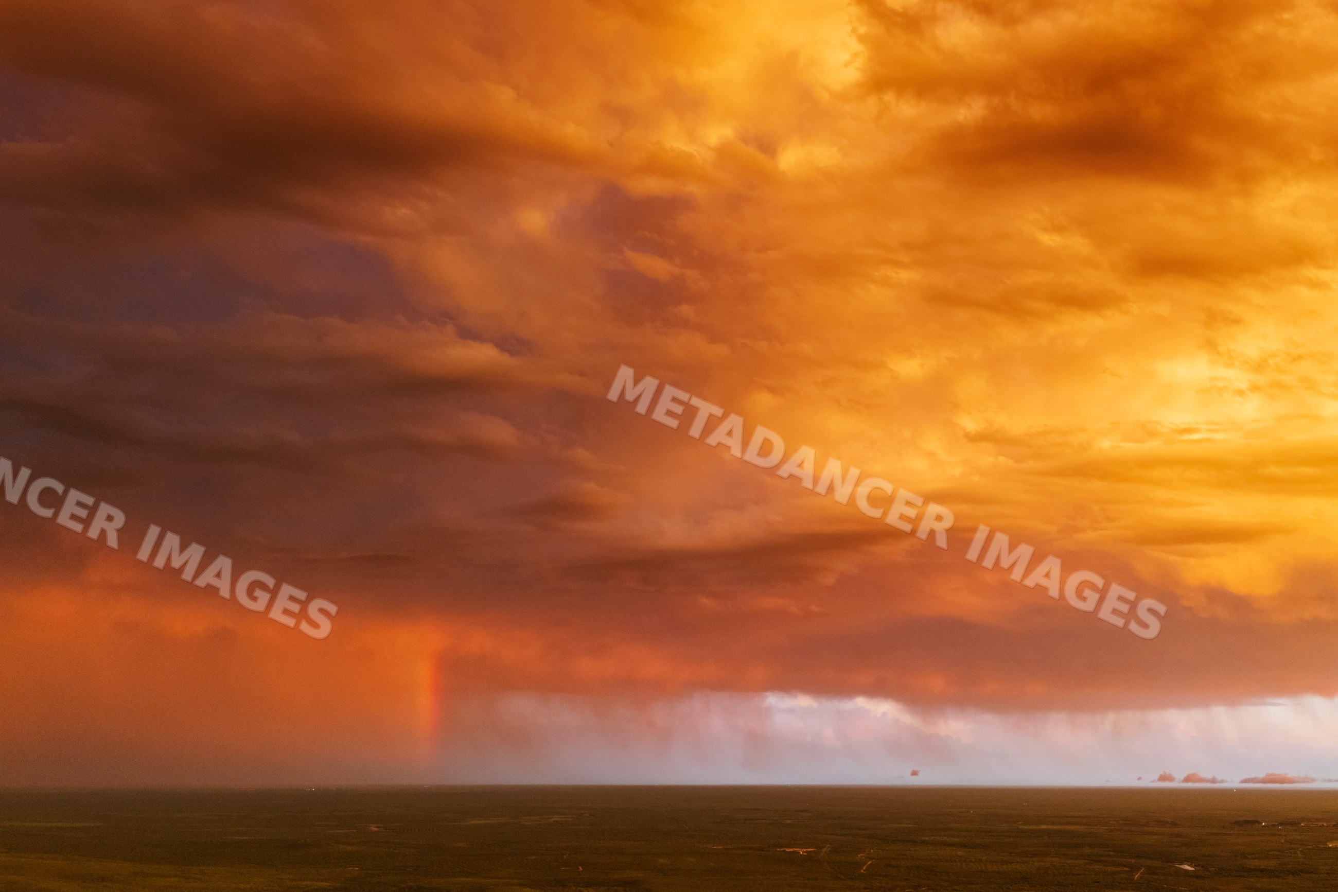 Storm clouds with Sunset and rainbow over uvalde, texas Great Plains