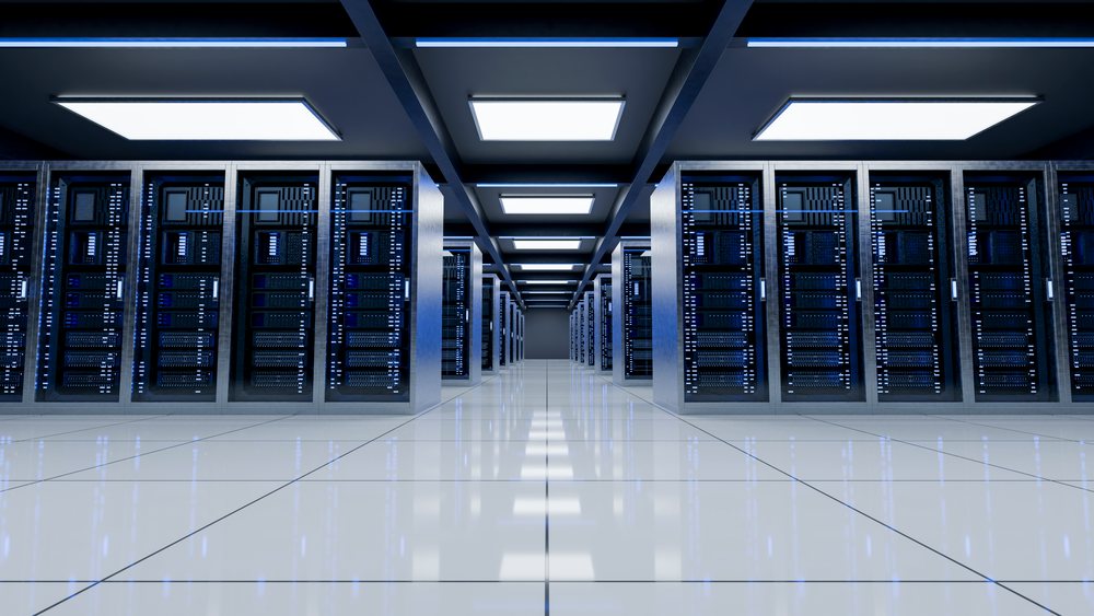 Modern data center hallway with rows of illuminated server racks