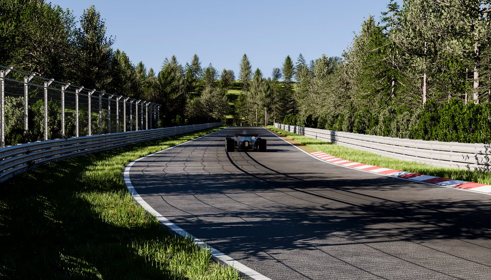 Race car driving down a forest-lined curved racetrack on a sunny day