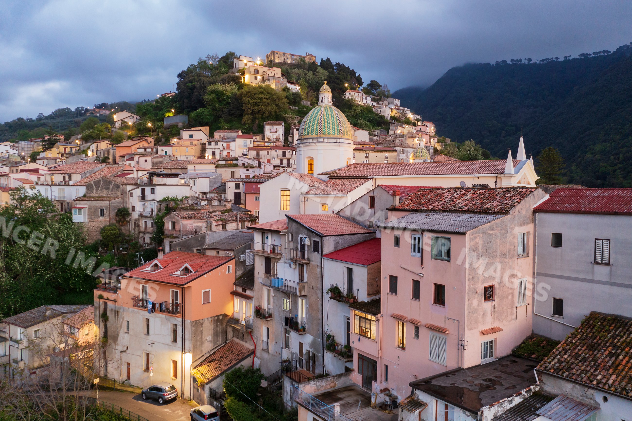 Nocera terinese hill town at sunset with church dome in calabria Italy
