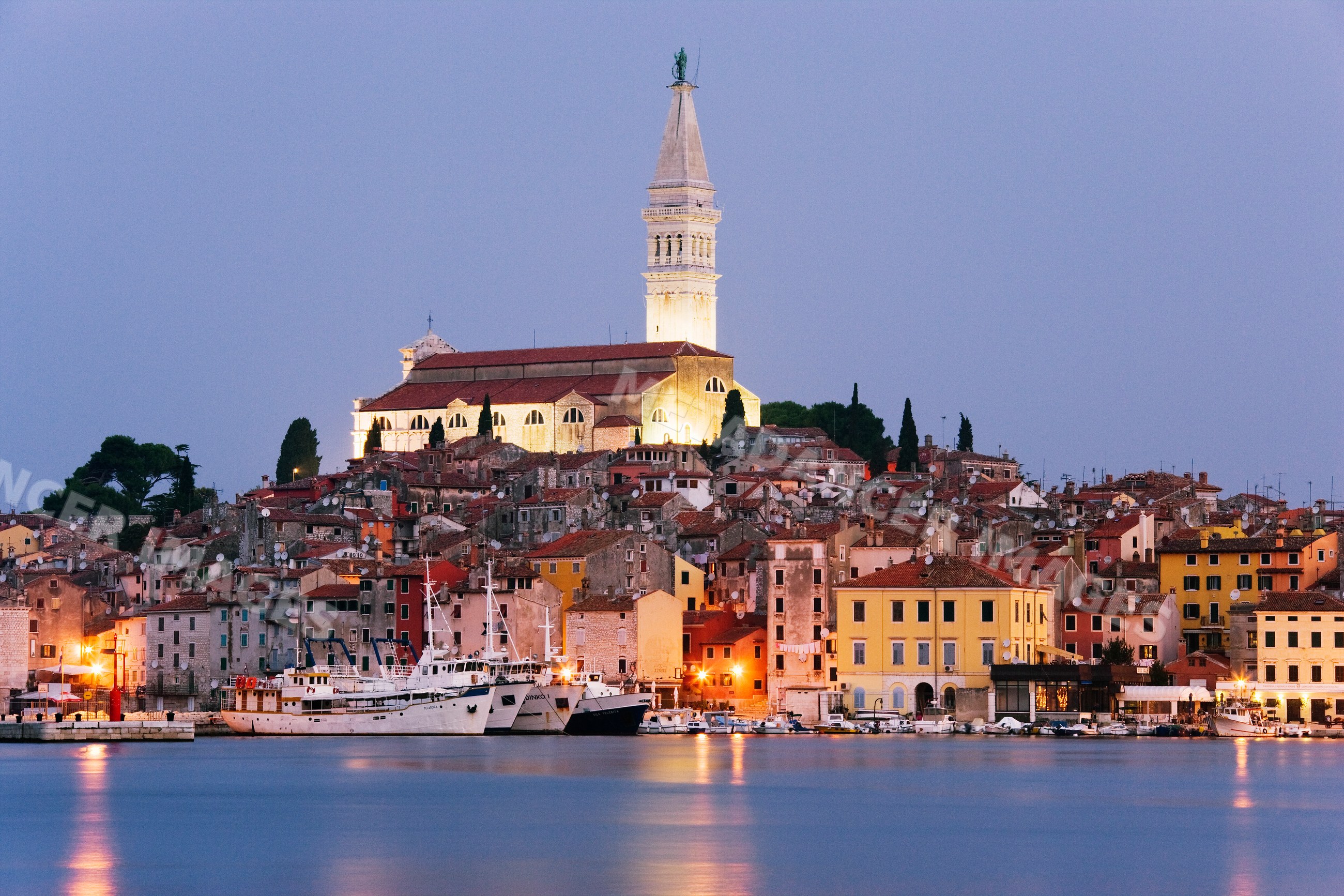 Rovinj town with church bell tower and harbor