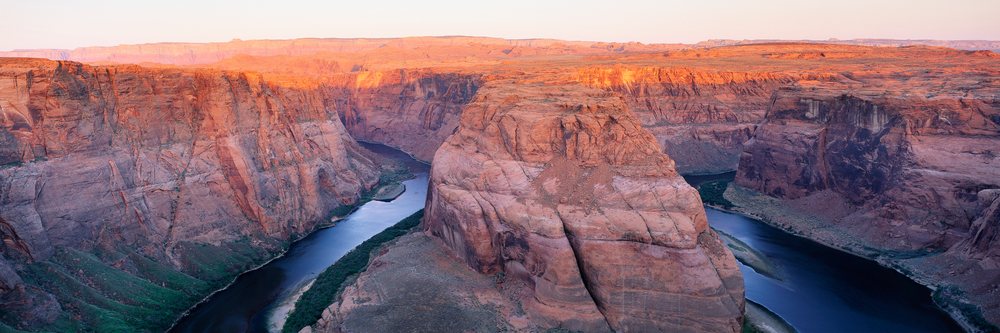 Horseshoe bend colorado river winding through red rock canyon
