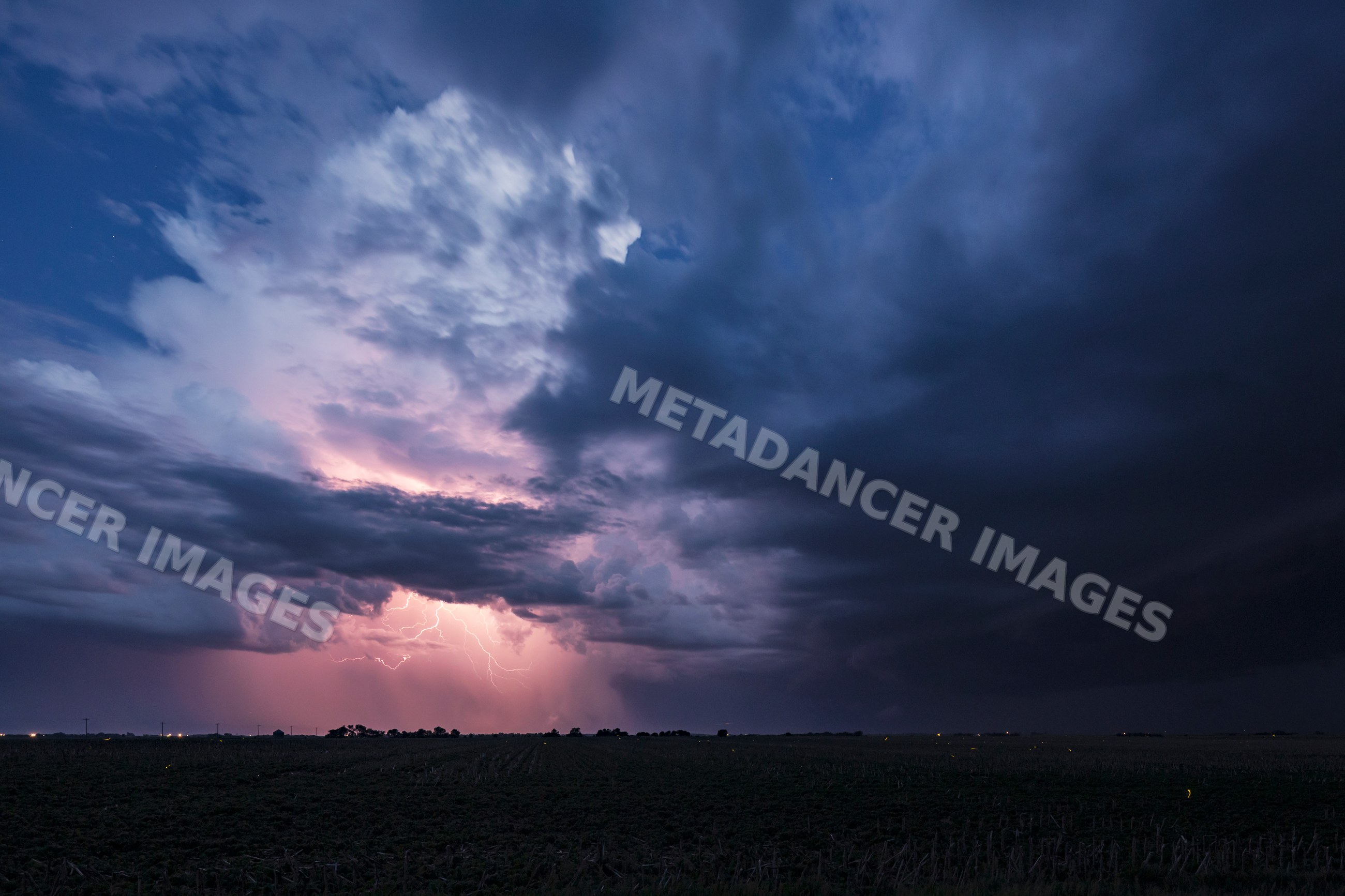 Lightning strikes amid dark Storm clouds over wilcox farmland