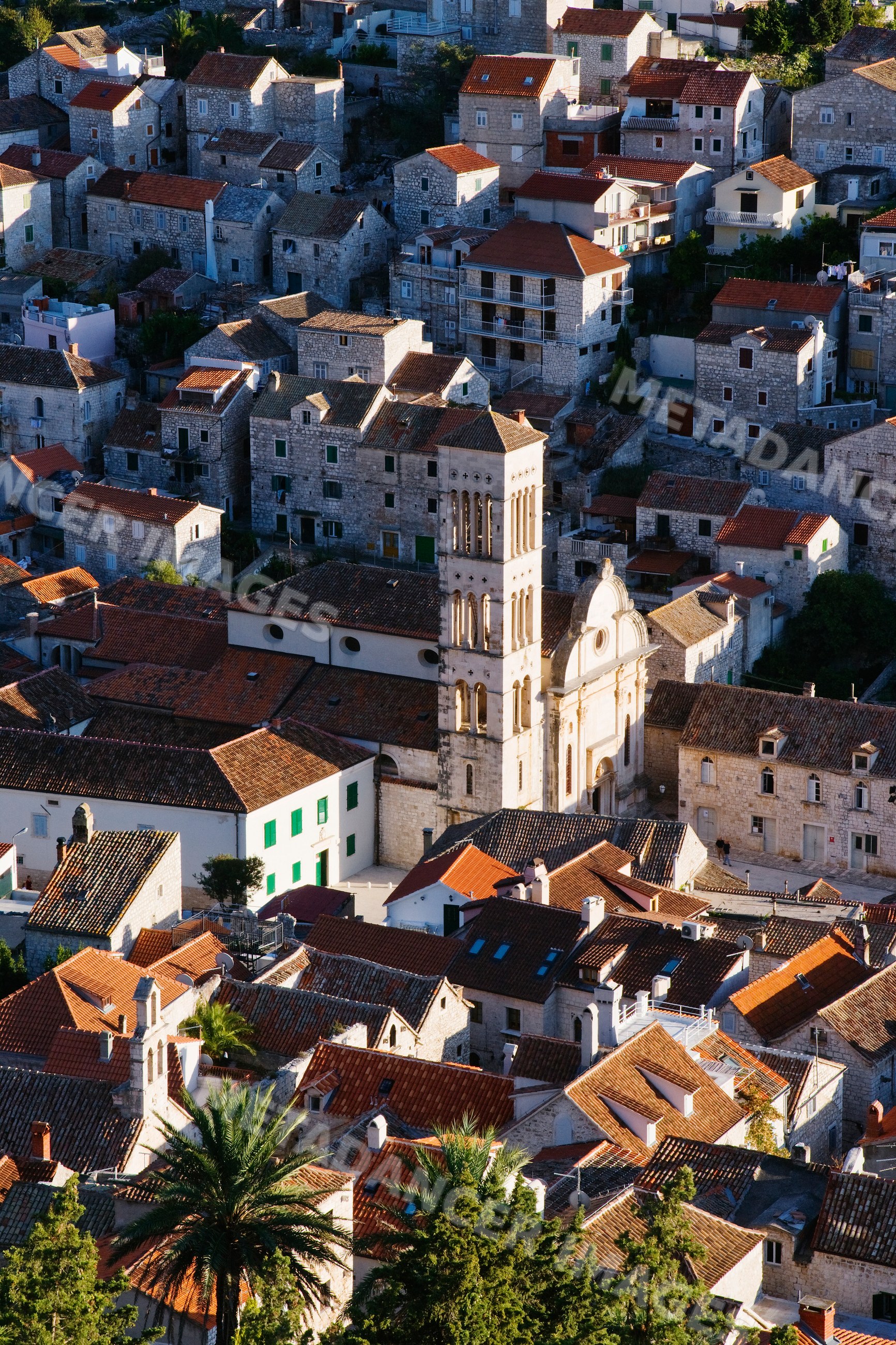 Historic town of hvar with stone houses and church bell tower