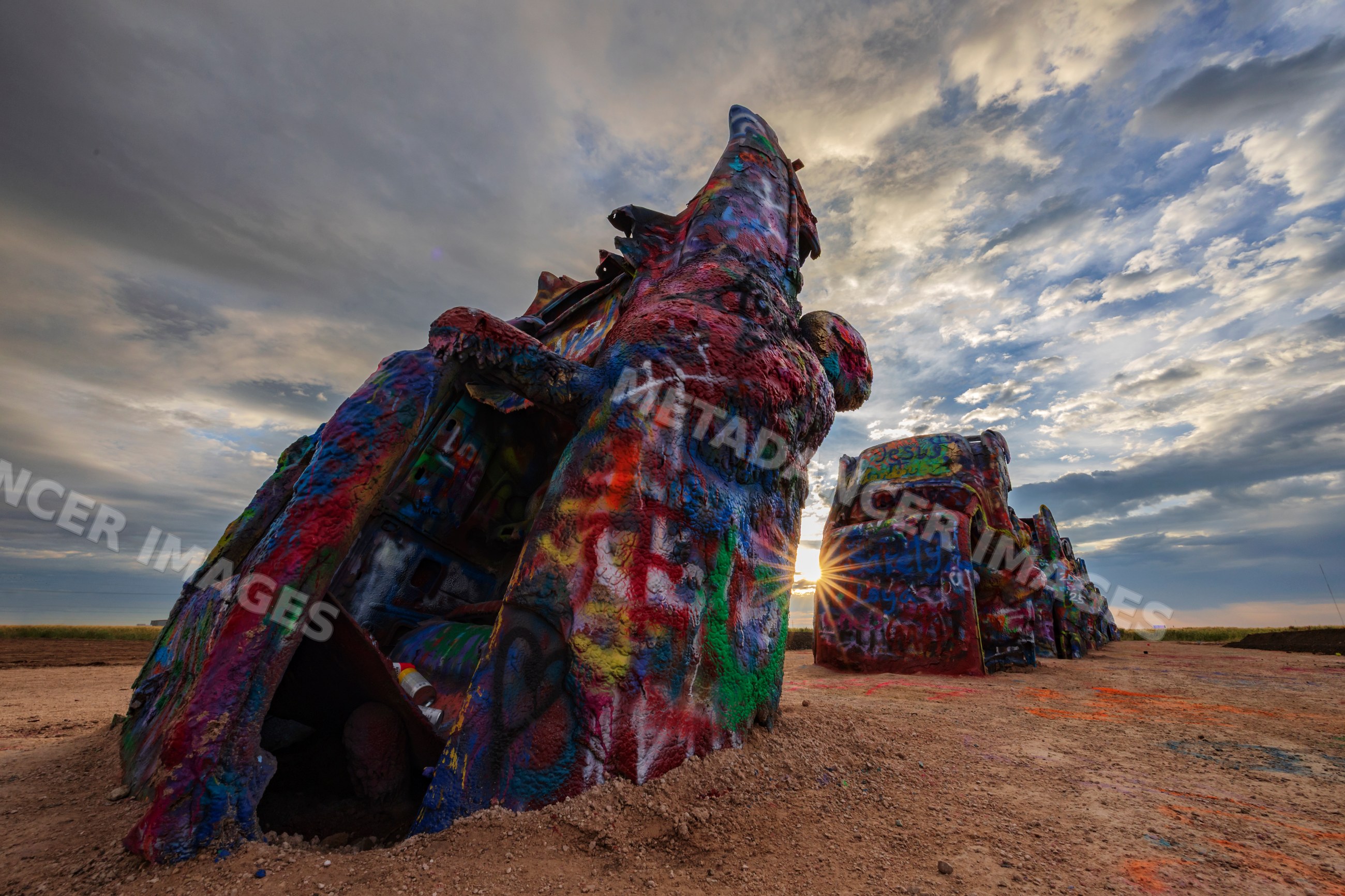 Cadillac ranch graffiti cars at Sunrise in amarillo texas