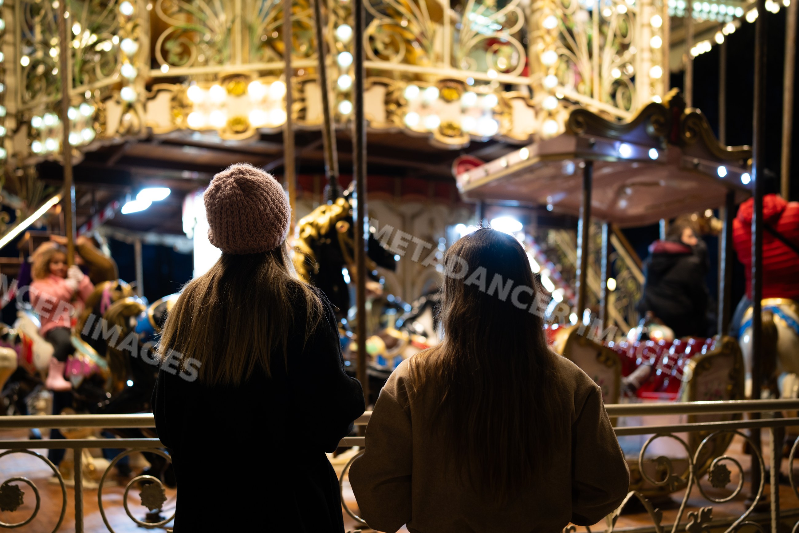 Christmas market carousel scene at night in Madrid