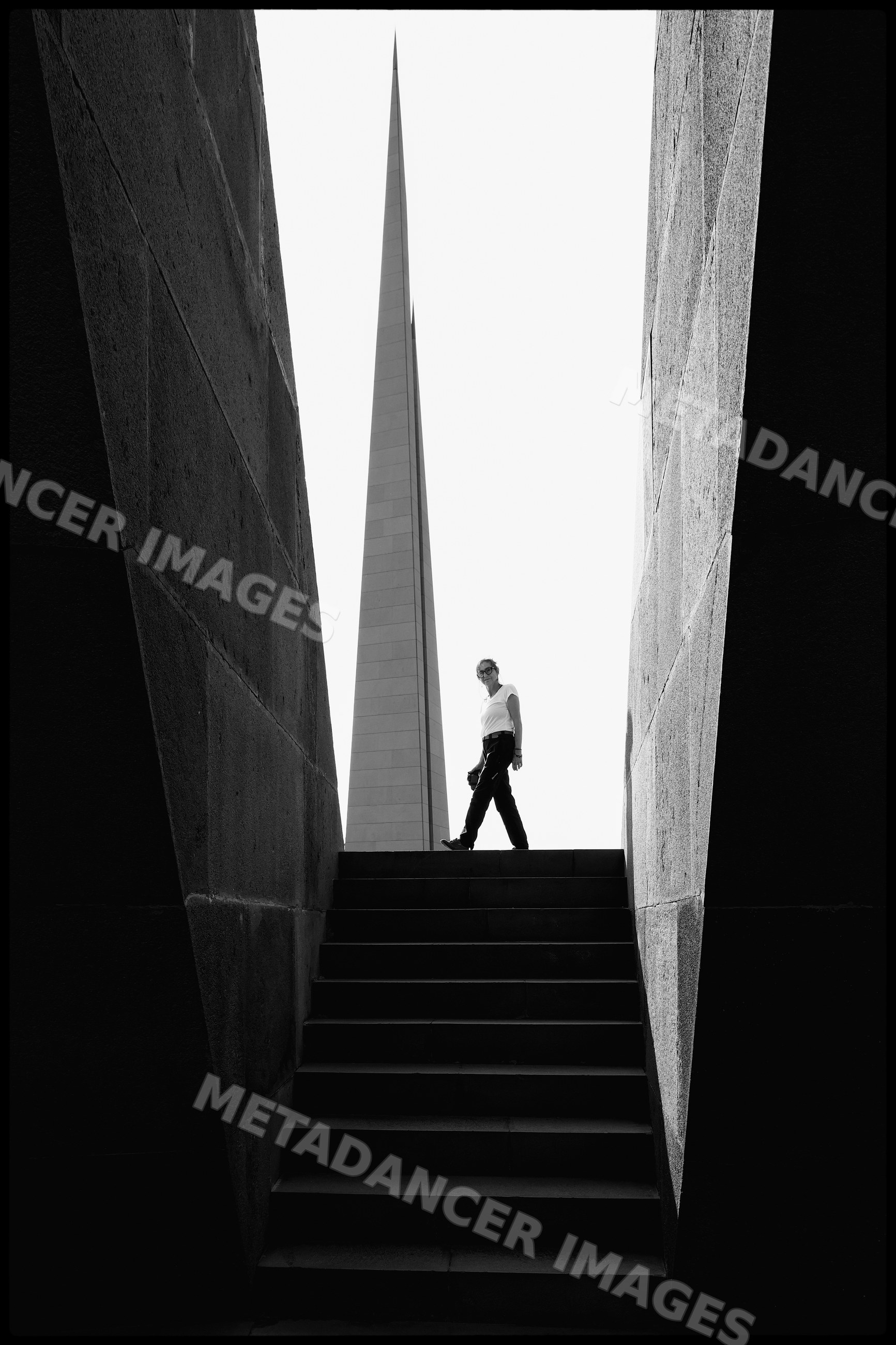 Person walking by the tsitsernakaberd memorial in yerevan, Armenia
