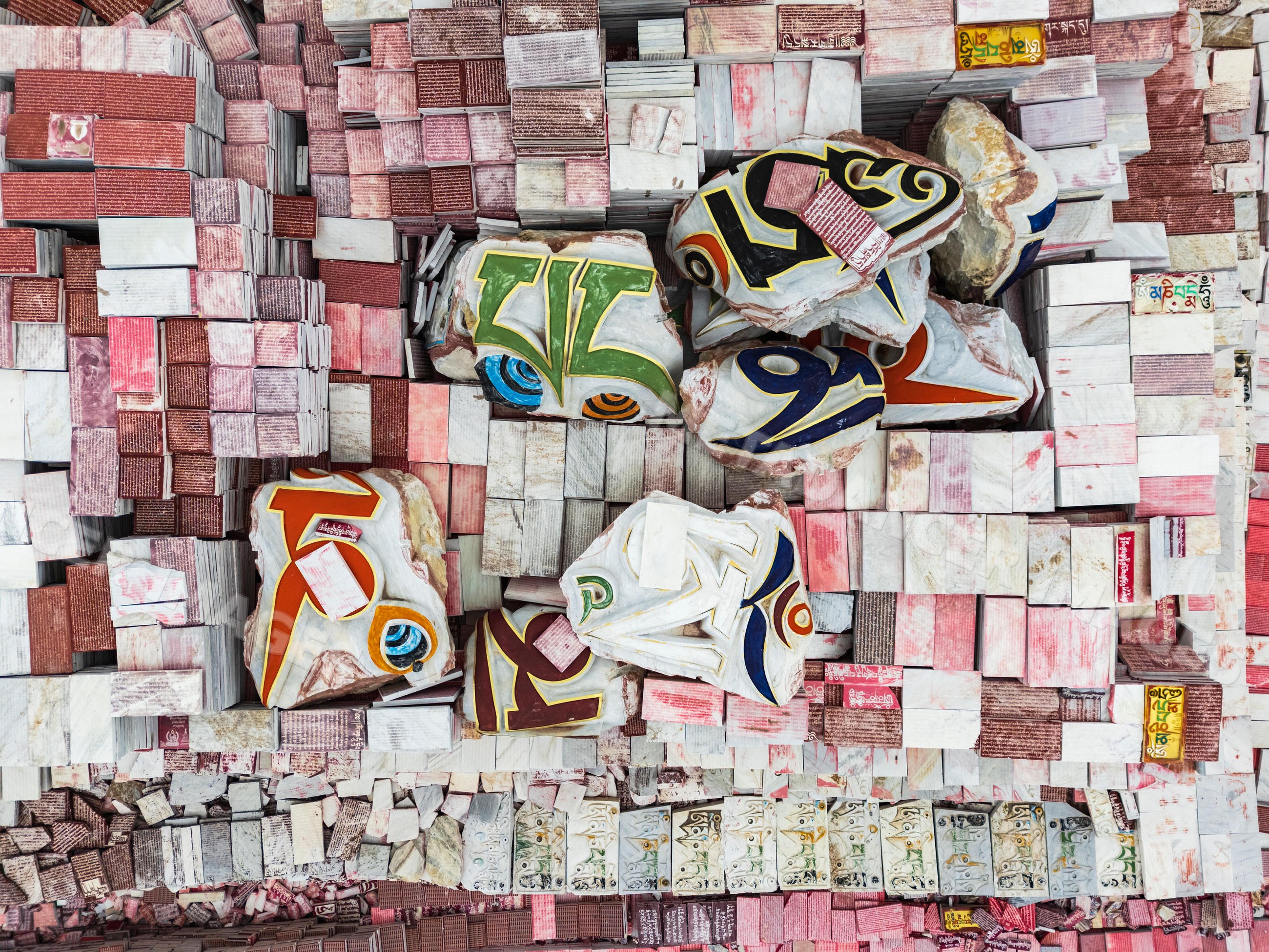 Aerial view of Jiana Mani City with colorful tibetan script stones