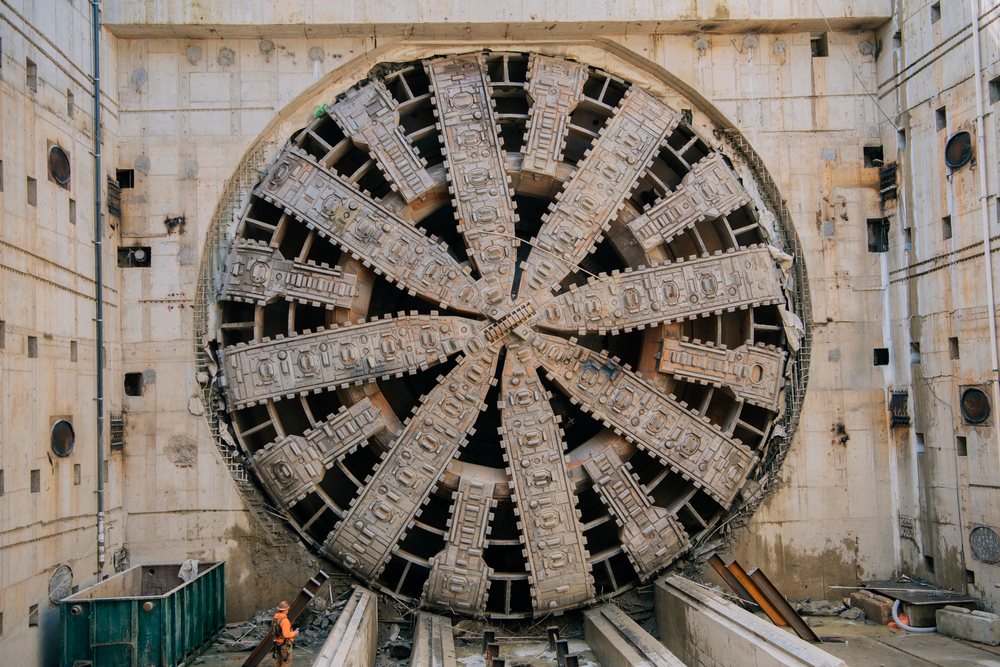 Large tunnel boring machine stands in a construction site