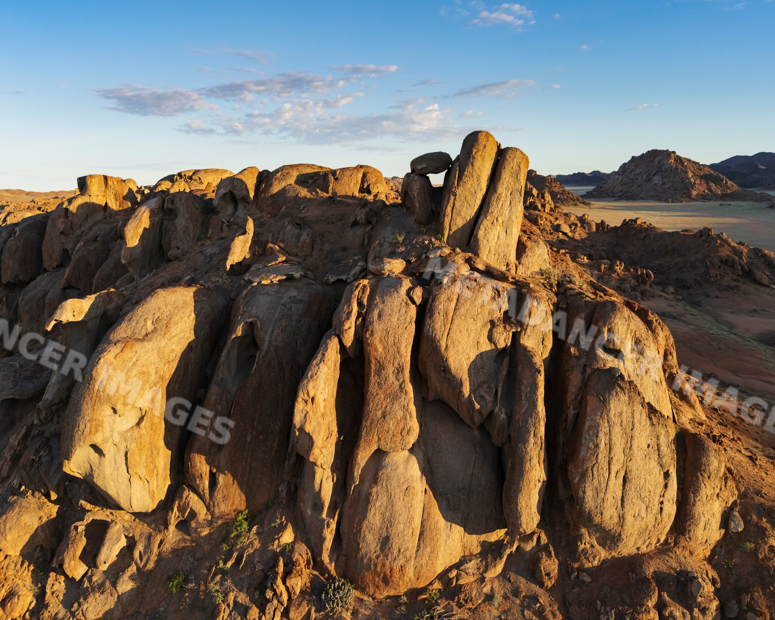 Balanced rock formation at sunrise in the bear at rock gardens Namibia