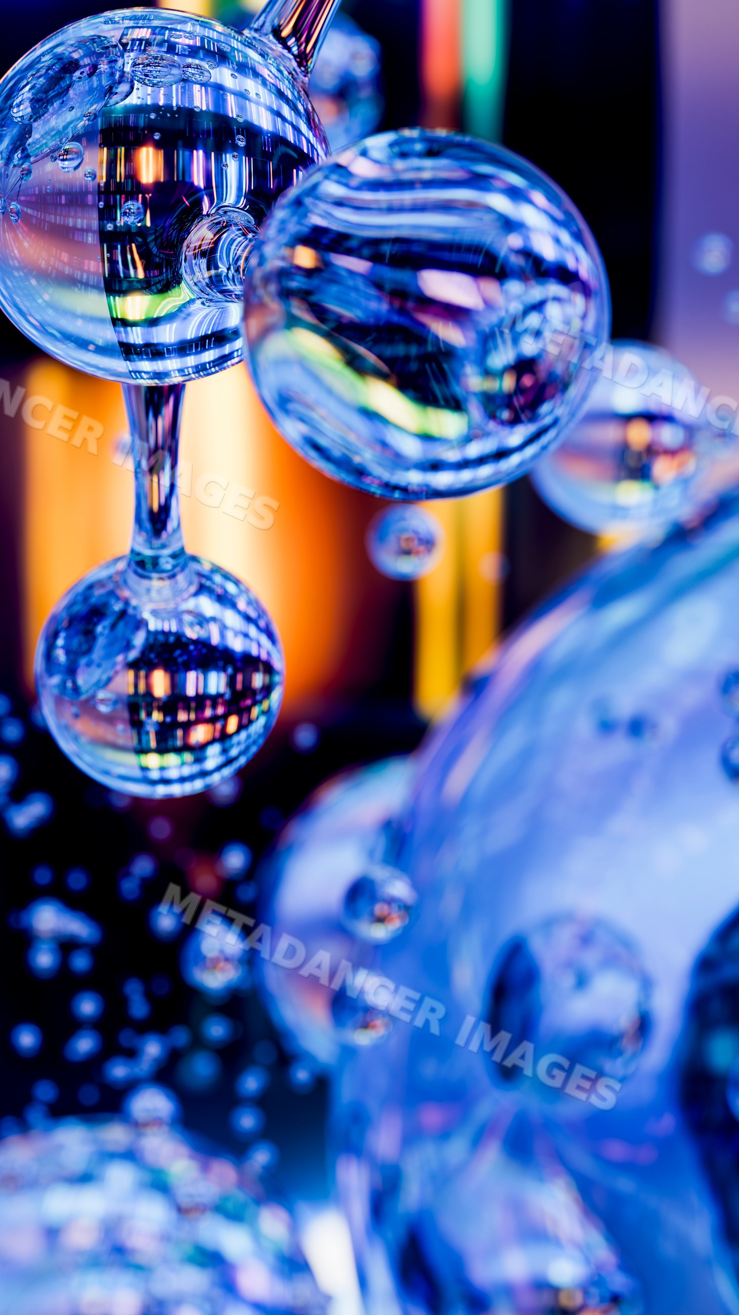 Glass bubbles with colorful reflections in close-up macro photography