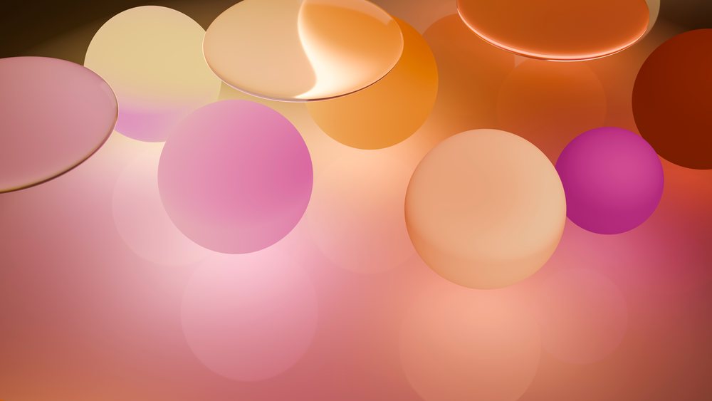 Colorful abstract spheres in soft orange and pink tones