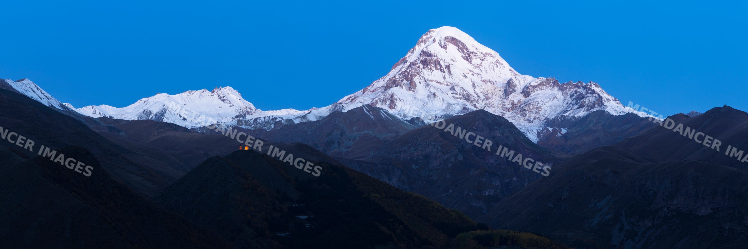 Gergeti Trinity Church and Mount Kazbegi at Dawn in Georgia