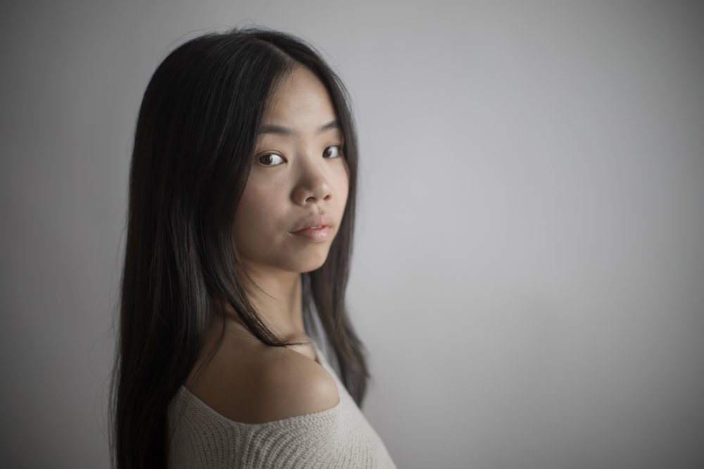 Emotional portrait of asian Southeast Asian woman with long hair