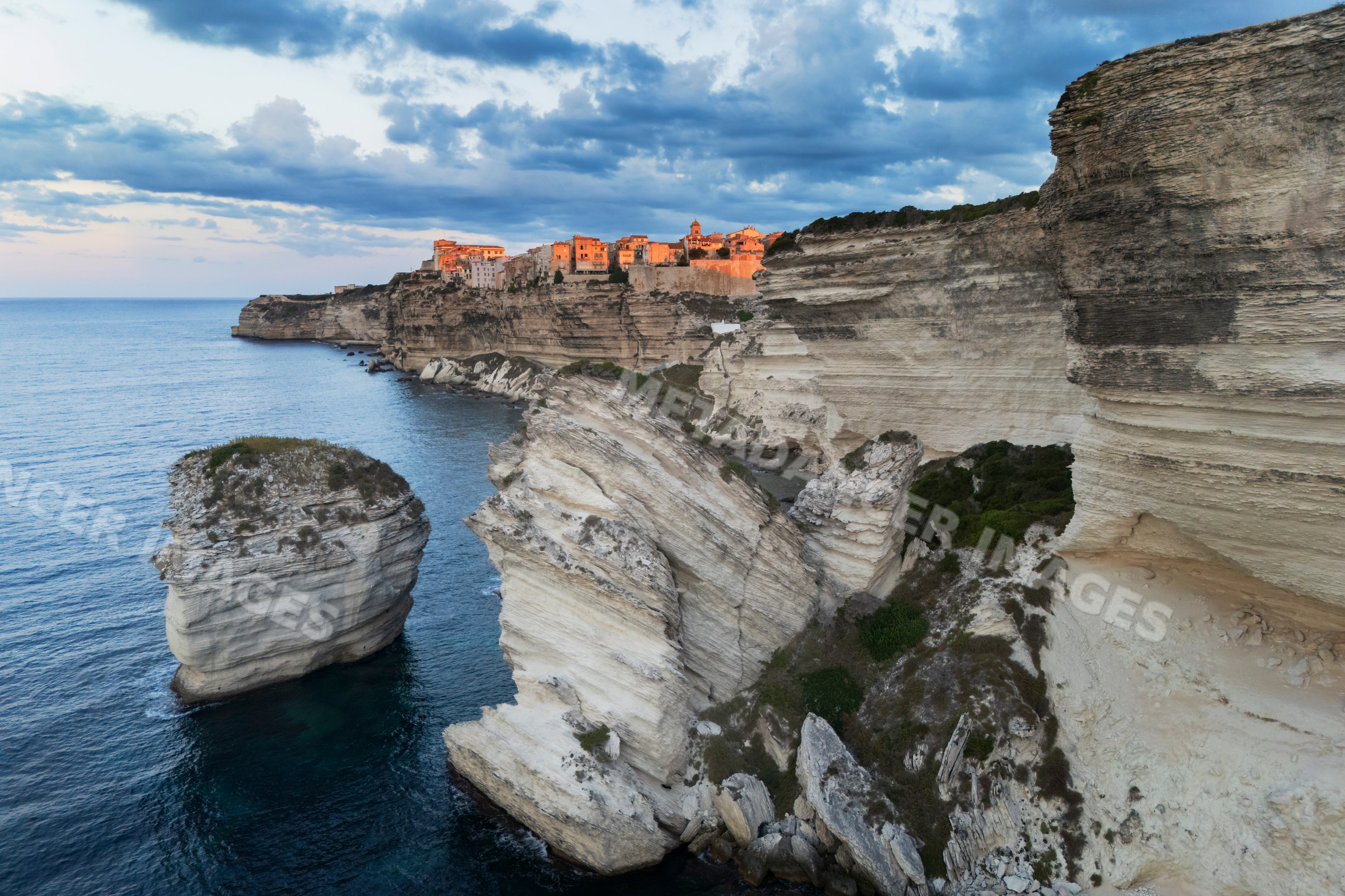 Citadel of Bonifacio at Sunrise on cliffs overlooking mediterranean