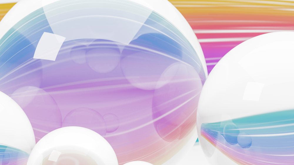 Glass and white spheres reflecting colorful abstract light patterns