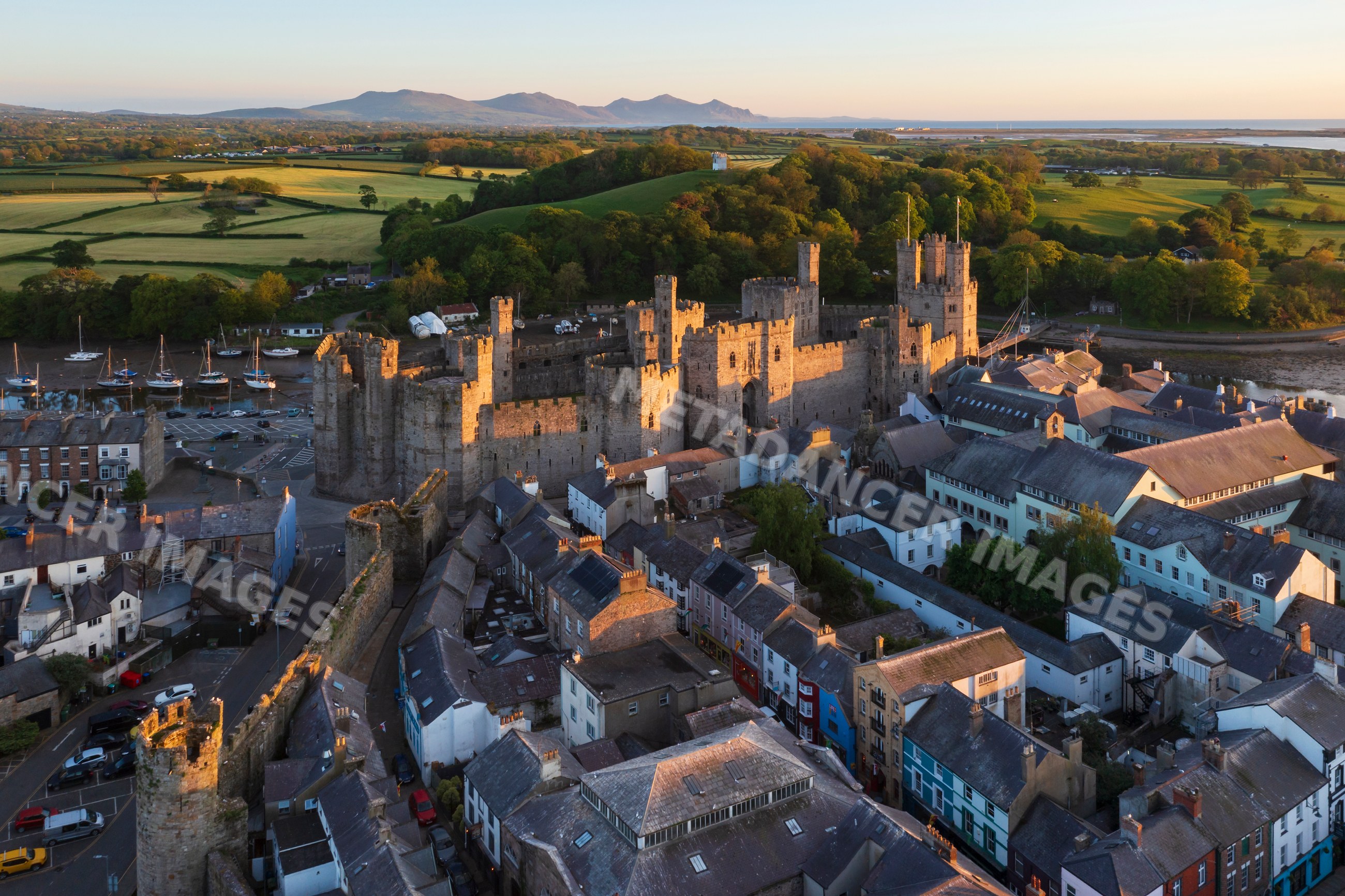 Aerial view of Caernarfon Castle and the walled city in gwynedd, Wales