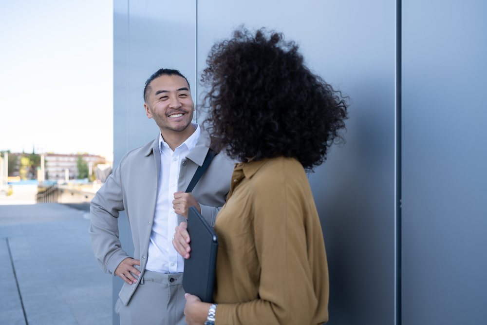 Two people having a friendly conversation outdoors