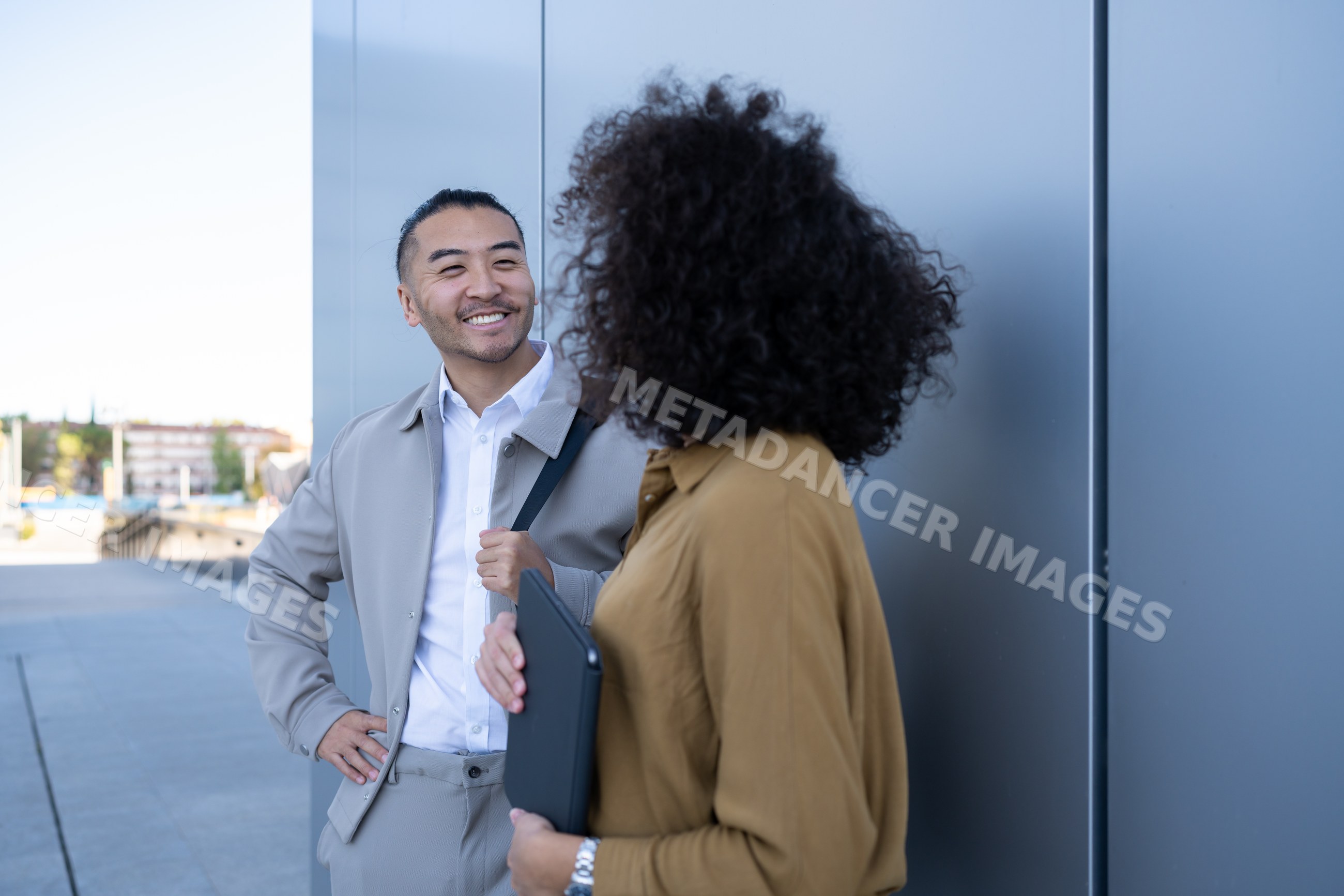 Two people having a friendly conversation outdoors