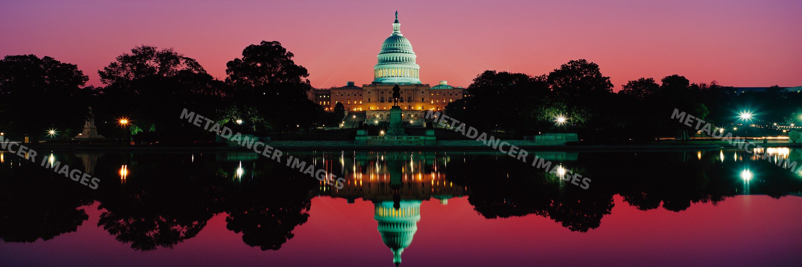 Capitol building at dusk with reflection