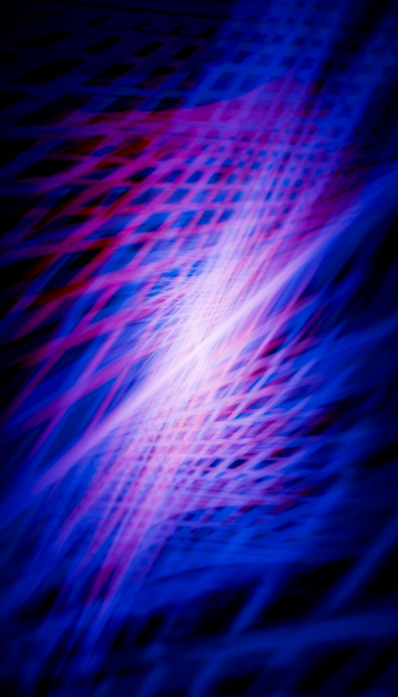 Abstract light trails form dynamic blue and pink geometric patterns