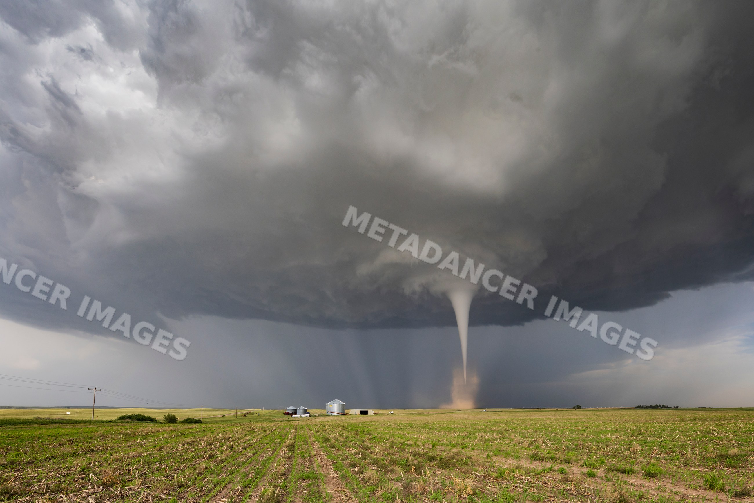 Tornado spinning over farmland near dickens, nebraska
