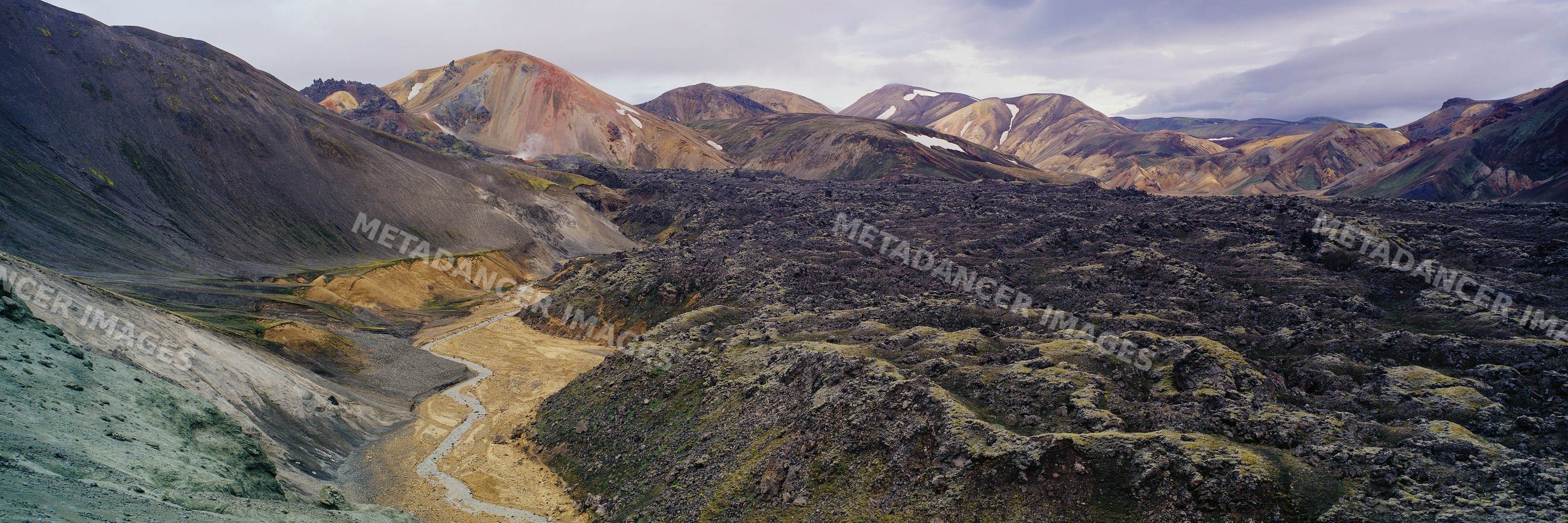 Volcanic lava fields and mountains in rugged natural landscape