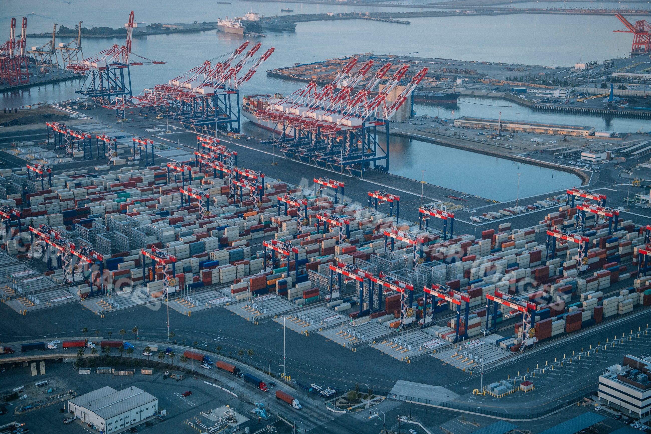 Aerial view of container cranes and shipping containers