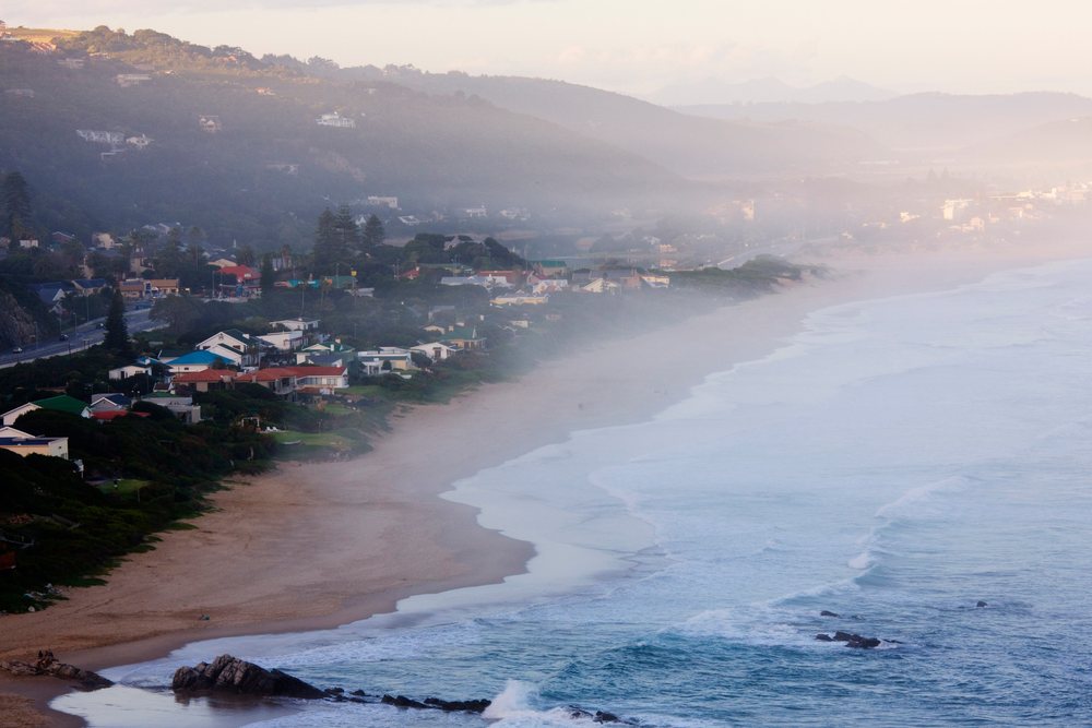 Ocean mist over hermanus beach at dusk, south africa