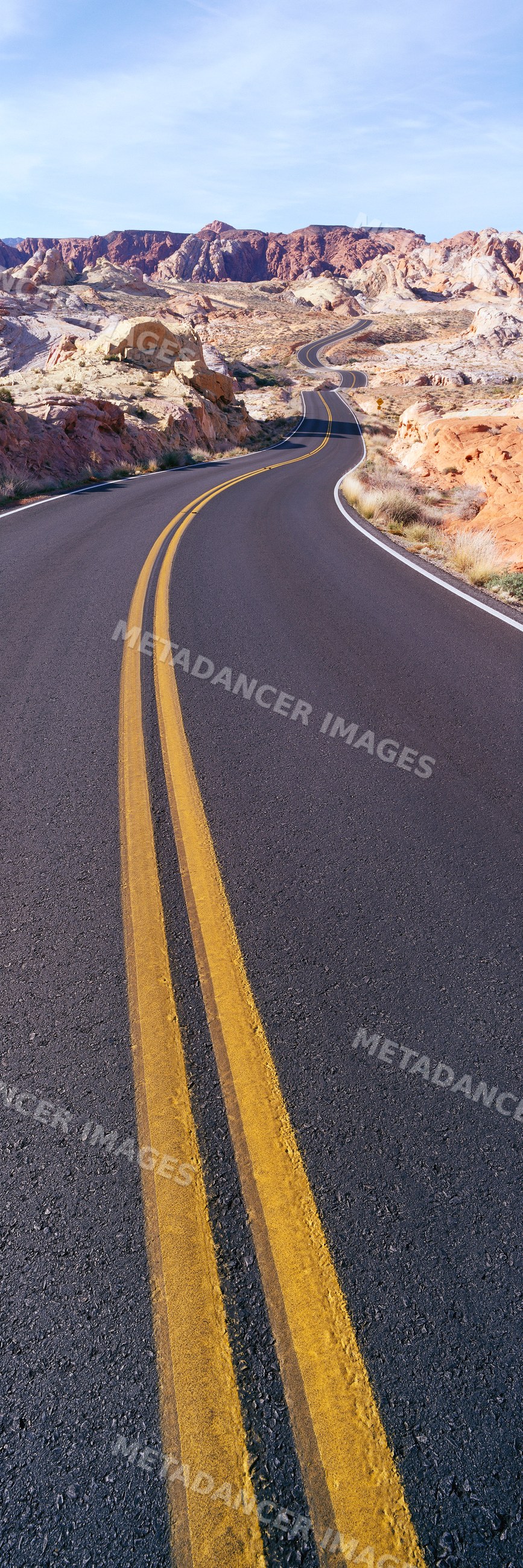 Desert road winding through rocky terrain USA