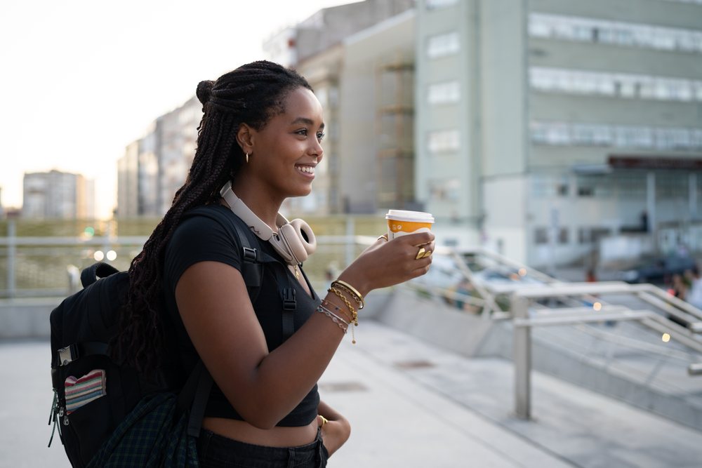 Young African American woman holding a coffee cup