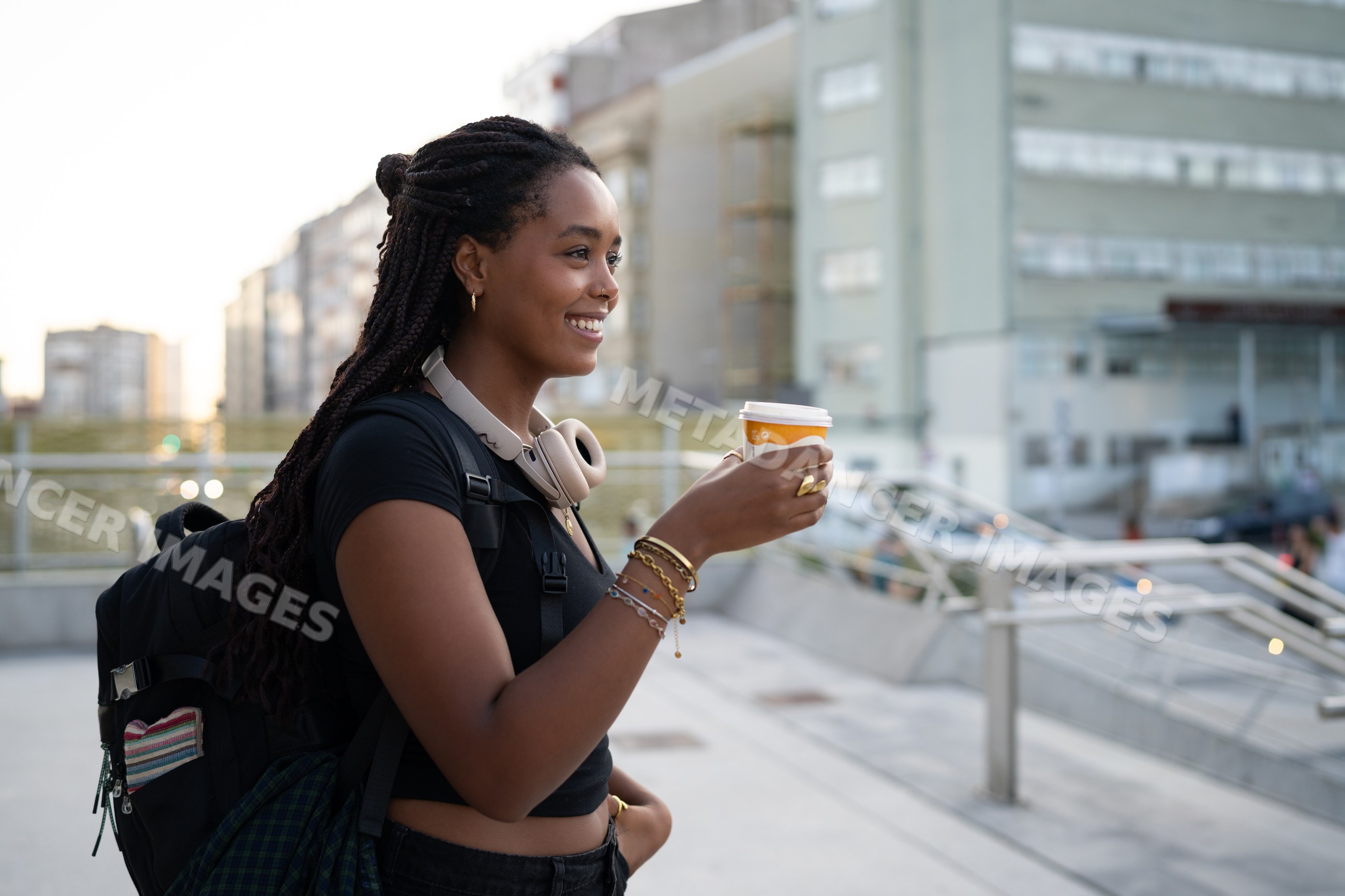 Young African American woman holding a coffee cup