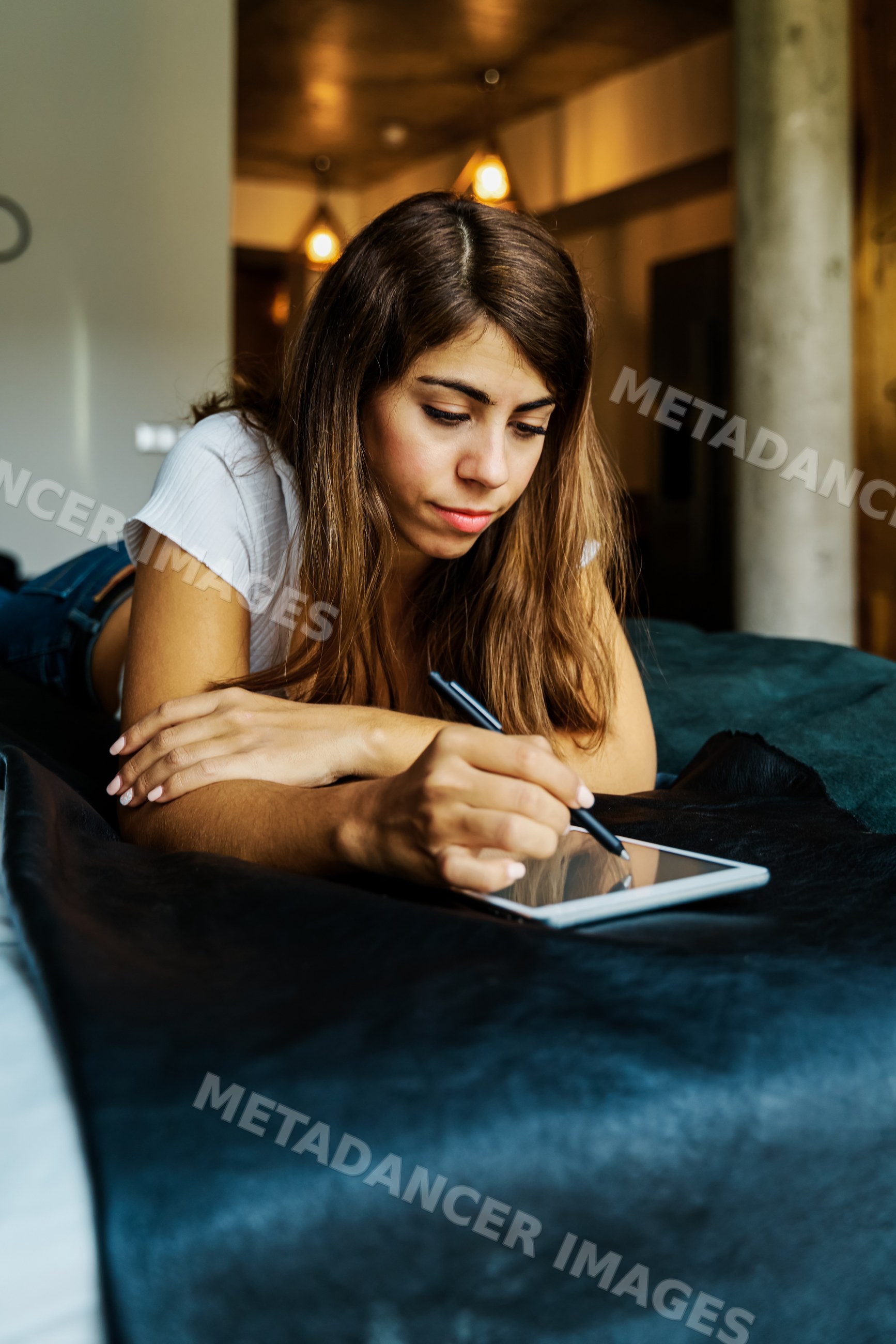 Woman writing on a digital tablet