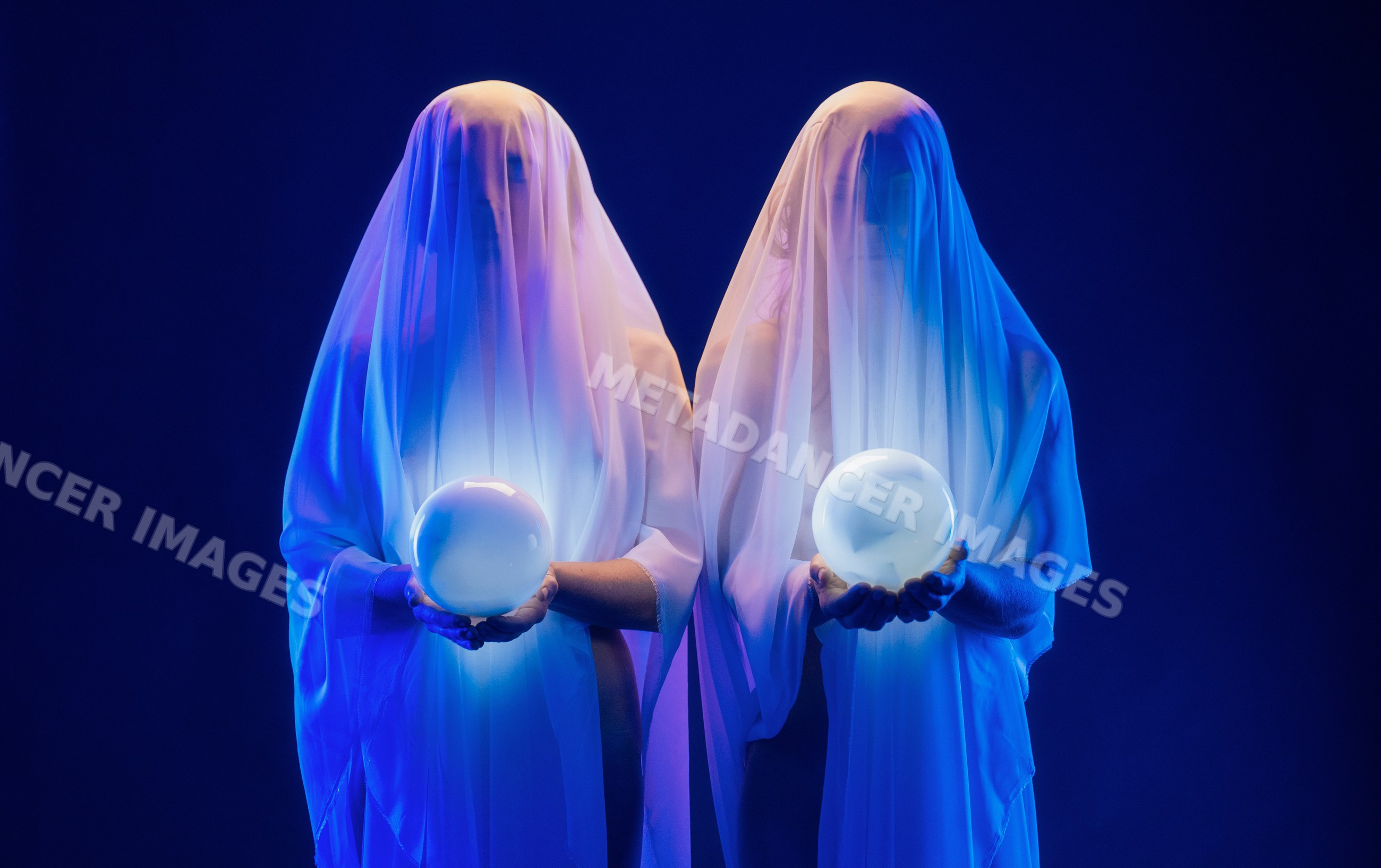 Ghostly figures holding glowing crystal balls in dark mystical scene