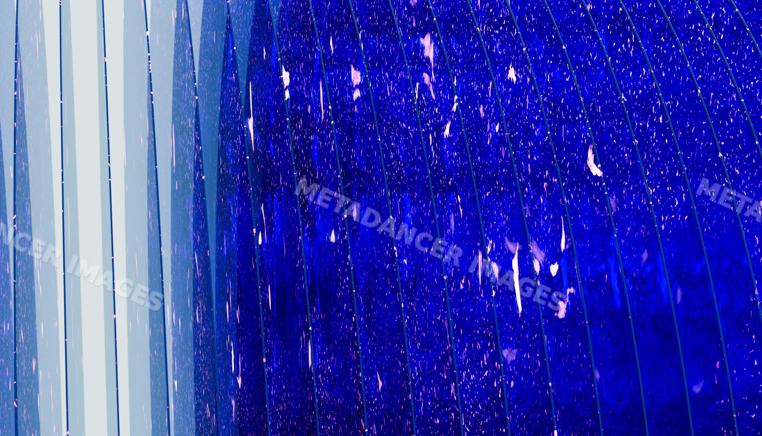 Blue glass panes with raindrops on modern architectural facade