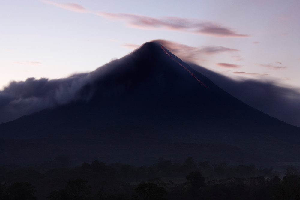 Arenal volcano erupting at dawn costa rica