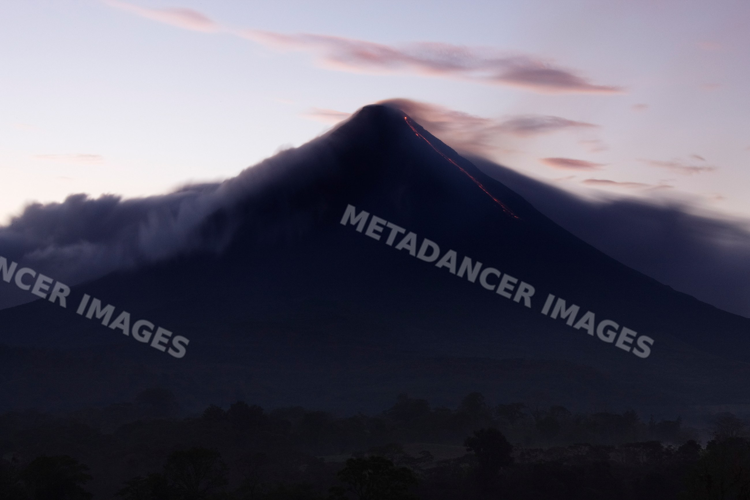 Arenal volcano erupting at dawn costa rica