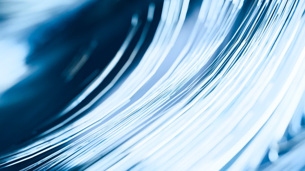 Abstract blue flowing wave-like lines digital illustration