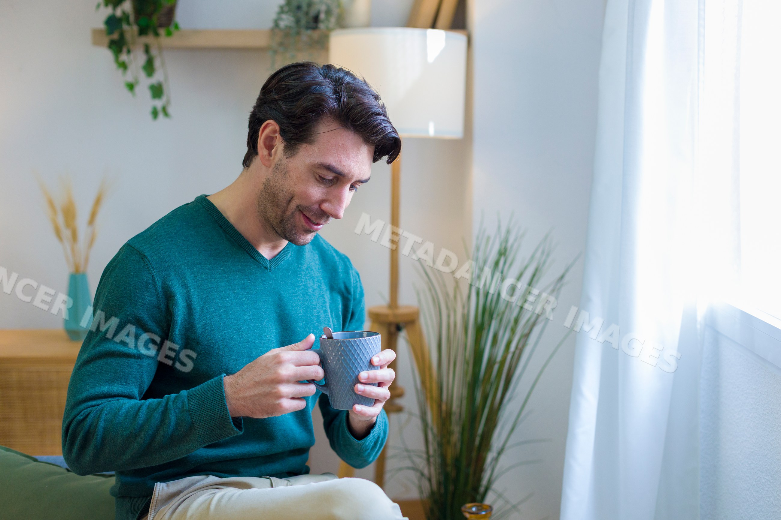 White man drinking coffee