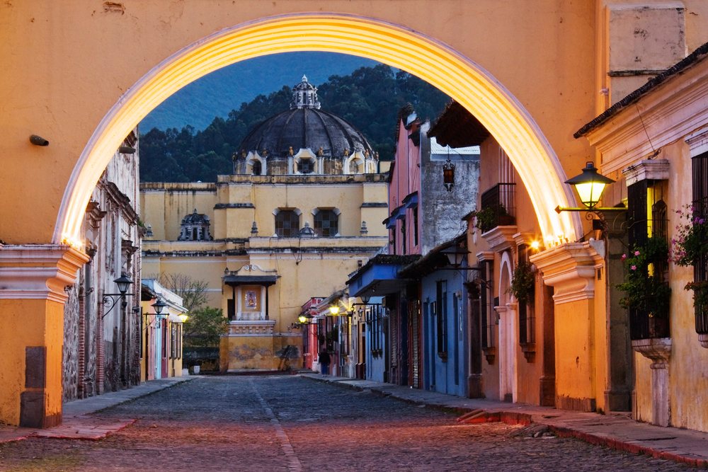 Santa catarina arch framing street and dome guatemala